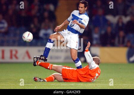 Queens Park Rangers' Matthew Rose (top) is tackled by Blackpool's John Hills (bottom) Stock Photo