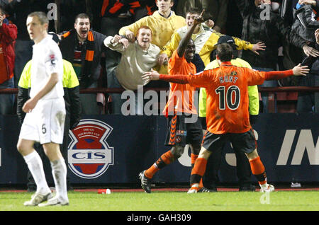 Dundee United's Morgaro Comis celebrates his goal with team mate Noal Hunt during the CIS Insurance Cup Semi Final match at Tynecastle Stadium, Edinburgh. Stock Photo