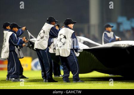 The ballboys ripple the giant UEFA Champions League starball logo Stock Photo