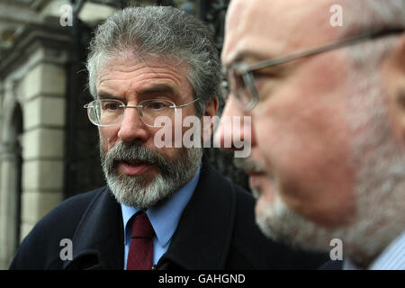 Sinn Fein Leader Gerry Adams (left) and Caoimhghin O'Coalain outside Leinster House in central Dublin. Stock Photo