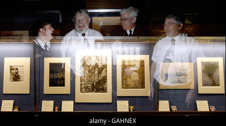 Gallery wardens are seen reflected in a glass cabinet at the new Warders' Choice exhibition at the National Gallery of Scotland in Edinburgh. Stock Photo