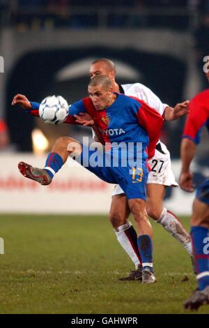 Soccer - UEFA Champions League - Group D - FC Basel v Manchester United. FC Basel's Christian Gimenez is under threat from Manchester United's Mikael Silvestre Stock Photo