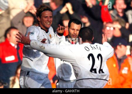 Soccer - FA Barclaycard Premiership - Liverpool v Manchester United. Manchester United's Diego Forlan celebrates scoring the opening goal with Ryan Giggs and John O'Shea Stock Photo