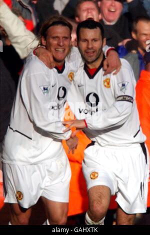 Manchester United's Diego Forlan celebrates scoring the opening goal with Ryan Giggs (r) Stock Photo