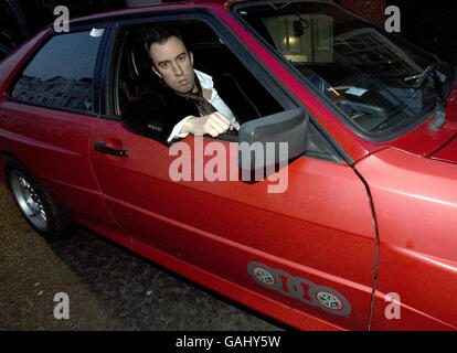 Virgin Radio disc jockey Christian O'Connell arrives at the Brit Awards Ceremony in a red Audi Quattro, similar to the one driven by Jean Hunt in the TV series Ashes to Ashes, Earls Court, London. Stock Photo