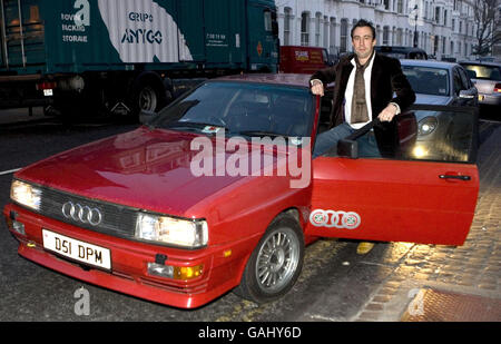 Virgin Radio disc jockey Christian O'Connell arrives at the Brit Awards Ceremony in a red Audi Quattro, similar to the one driven by DCI Gene Hunt in the TV series Ashes to Ashes, Earls Court, London. Stock Photo