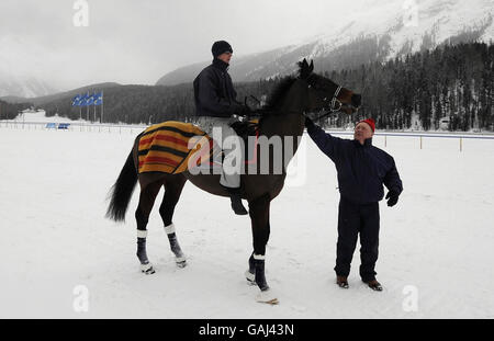 Horse Racing - White Turf - St Moritz. British racehorse trainer Ron Harris checks his horse Arturius on the frozen lake at St Moritz, Switzerland. Stock Photo