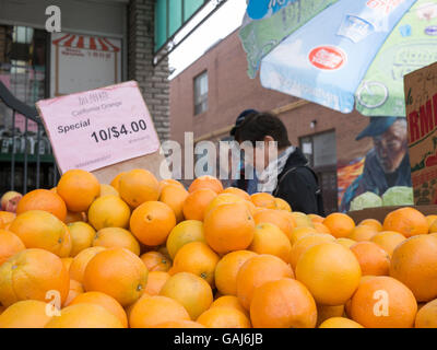 Vendors & shoppers in Chinese market, Toronto, Canada. Stock Photo
