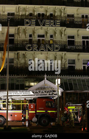 Firefighters tackle a fire at the historic Grand Hotel on Brighton seafront. Stock Photo