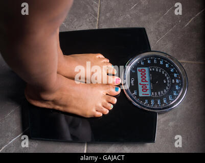 the bathroom scales that speaks to you and tells you the truth by writing it on the screen: good job! Stock Photo