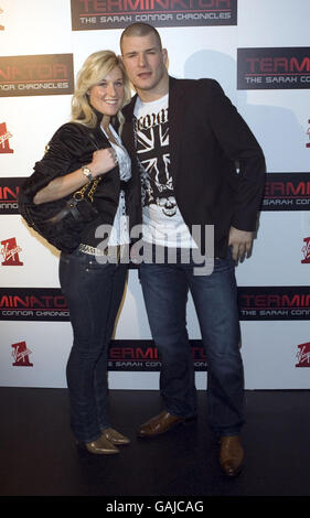 Michael Bisping and guest arrive for the Terminator: The Sarah Connor Chronicles launch party at 24 London, in west London. Stock Photo