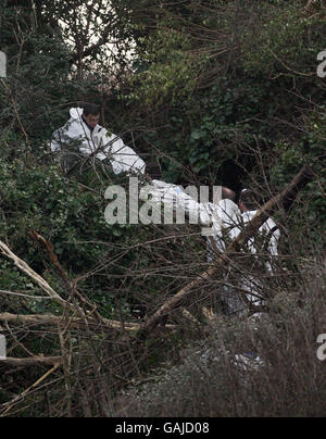 Forensic experts remove a body from the scene at Bray Head, Co Wicklow, Ireland. Stock Photo