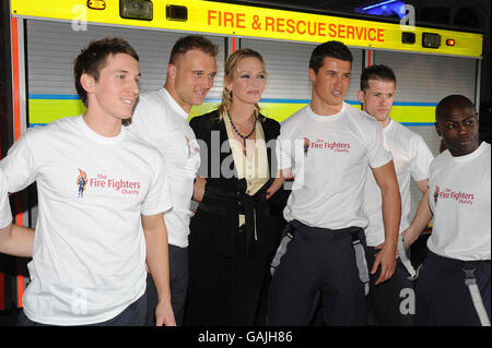 Uma Thurman arrives with firemen for the UK premiere of The Accidental Husband at the Vue Cinema in Leicester Square, London. Stock Photo