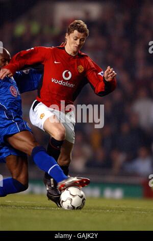 Soccer - Worthington Cup - Third Round - Manchester United v Leicester City. Manchester United's Ole Gunnar Solskjaer (r) is challenged by Leicester City's Frank Sinclair (l) Stock Photo