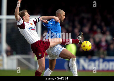 Peterborough United's Jason Lee battles for the ball with Northampton Town's Paul Trollope Stock Photo