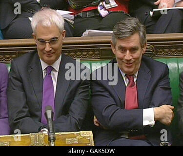 Prime Minister Gordon Brown and Chancellor of the Exchequer Alistair Darling listen to Leader of the Opposition David Cameron responding to the Budget speech given by in the House of Commons. Stock Photo