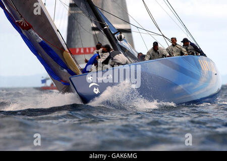 OneWorld (USA) rounds the windward mark ahead of Prada (Italy) in the first race of the Louis Vuitton semi finals held on Auckland's Hauraki Gulf, Tuesday. Stock Photo