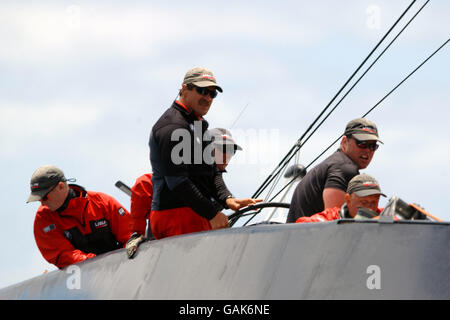 Helmsman Peter Holmberg Oracle (USA) in the first race of the Louis Vuitton semi finals held on Auckland's Hauraki Gulf, Tuesday. Stock Photo