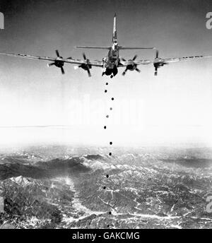 Each one is a heavy bomb plummeting to an enemy target lying in the rugged, mountainous terrain of Korea. This awesome picture was made from a B-29 Superfort of the American Far East Air Force' 19th Bomber Group as, with bomb doors open, the lead plane hurtled its cargo earthwards. Stock Photo