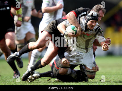 Rugby Union - Heineken Cup - Quarter Final - Saracens v Ospreys - Vicarage Road. Ospreys Marty Holah is tackled by Saracens Richard Hill during the Heineken Cup Quarter Final match at Vicarage Road, Watford. Stock Photo