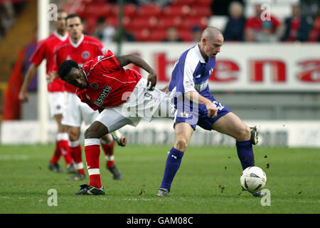 Charlton Athletic's Jason Euell (l) challenges Exeter City's Glenn Cronin (r) Stock Photo