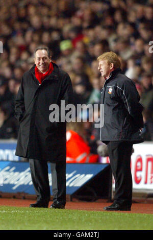 Liverpool's Manager Gerard Houllier is all smiles as he sees his team win for the first time in a long time as Southampton manager Gordon Strachan looks on Stock Photo