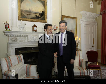 Prime Minister Gordon Brown (right) shakes hands with French President Nicolas Sarkozy inside 10 Downing Street, London. Stock Photo