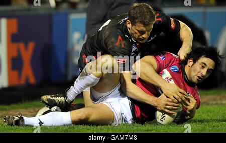 Sale's Mark Cueto tackles Brive's Gregory Mahe during the European Challenge Cup match at Edgeley Park, Sale. Stock Photo