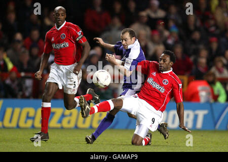 Charlton Athletic's Jason Euell tackles Exeter City's Martin Thomas Stock Photo