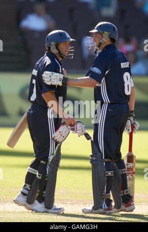 Victoria Bushrangers' David Hussey (r) congratulates teammate Brad Hodge (l) on scoring a century Stock Photo