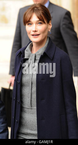 French President Nicolas Sarkozy's wife Carla Bruni Sarkozy adjusts her ...