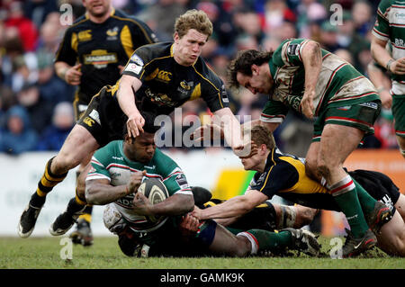 Rugby Union - Guinness Premiership - Leicester Tigers v London Wasps - Welford Road. Leicester's Seru Rabeni is tackled by James Hskell and Tom Rees of Wasps during the Guinness Premiership match at Welford Road, Leicester. Stock Photo