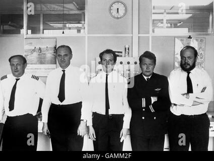 From left to right: Captain Charles Taylor, Supernumeracy Captain Geoffrey S. Moss, Senior First Officer Francis B. Kirkland, First Officer John C. Hutchinson, and Engineer Officer Thomas c. Hicks, the flight crew of the Australia bound Boeing 707 jetliner of BOAC which crashed in flames at Heathrow Airport, only 4 minutes after take-off. Of the 126 people on board, 103 were known to have survived. There were 5 known dead. Stock Photo