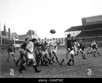 Rugby Union - Five Nations Championship - Wales v England. England's Simon Clarke (r) kicks to touch as he is tackled by Wales' Brian Thomas (second r) Stock Photo