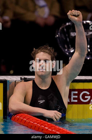 Great Britain's Liam Tancock celebrates winning gold in the 100 metres backstroke during the FINA World Short Course Championships at the MEN Arena, Manchester. Stock Photo