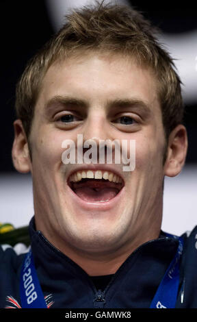 Great Britain's Liam Tancock celebrates winning gold in the 100 metres backstroke during the FINA World Short Course Championships at the MEN Arena, Manchester. Stock Photo