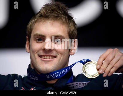 Great Britain's Liam Tancock celebrates winning gold in the 100 metres backstroke during the FINA World Short Course Championships at the MEN Arena, Manchester. Stock Photo