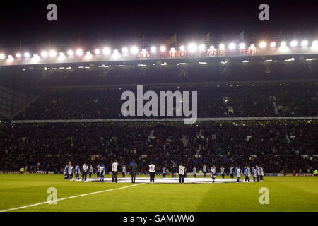 Ballboys surround the giant UEFA Champions League starball logo in the centre circle Stock Photo