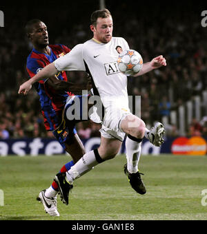 Manchester United's Wayne Rooney and Barcelona's Eric Abidal during the UEFA Champions League Semi Final First Leg match at Nou Camp, Barcelona, Spain. Stock Photo