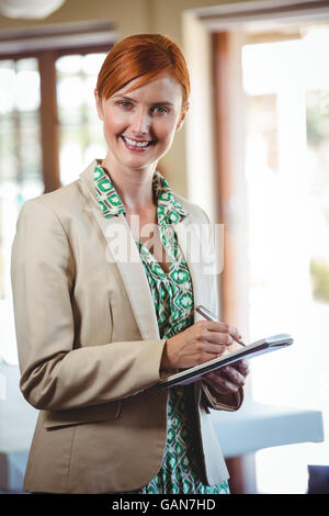 Woman writing in a notebook Stock Photo