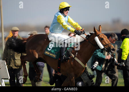 Kruguyrova, ridden by jockey Tony McCoy, in action during the John Smith's Maghull Novices' Chase. Stock Photo