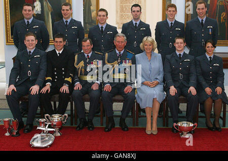 Prince William (back row right), with fellow graduates, and his father the Prince of Wales and the Duchess of Cornwall (front row centre), following the graduation ceremony at RAF Cranwell where William received his RAF wings from his father. Stock Photo