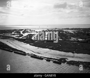 Air view of Canvey Island, Thames Estuary bungalow holiday resort overwhelmed by Britain's east coast flood disaster. In the background is the river Thames and the Kent coast. Compulsory evacuation of the last 2,000 of canvey's population of about 12,000 occurred. At least 100 people were known to have lost their lives, and at the time 500 were still missing. Stock Photo