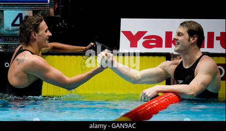 Great Britain's Liam Tancock celebrates winning silver in the 200metres Individual Medley with gold medalist Ryan Lochte during the FINA World Short Course Championships at the MEN Arena, Manchester. Stock Photo