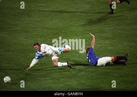 Soccer - UEFA Champions League - Group Stage - Group A - Marseille v Rangers - Stade Velodrome. Rangers' Stuart McCall brings down Marseille's Didier Deschamps. Stock Photo