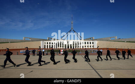 Australian Federal Police spring into action during the Beijing 2008 Olympic Torch Relay in Australia Stock Photo