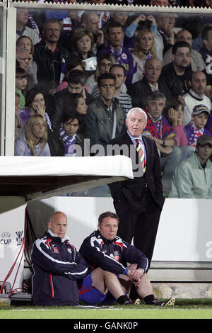 (left to right) Rangers first Team Coach Kenny McDowall, assistant manager Ally McCoist and manager Walter Smith in the dugout Stock Photo