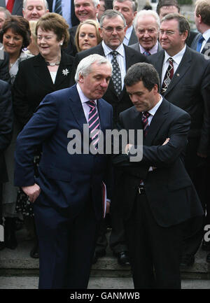 Taoiseach Bertie Ahern speaks with transport minister Noel Dempsey after Brian Cowen was publicly unveiled as Fianna Fail party leader-designate today outside the Dail parliament in Dublin. Stock Photo