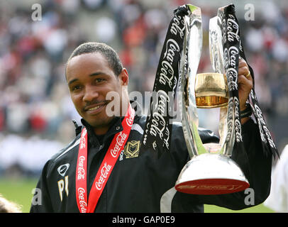 Milton Keynes Dons' Manager Paul Ince with the League Two Trophy after the Coca-Cola League Two match at Stadium:MK, Milton Keynes. Stock Photo