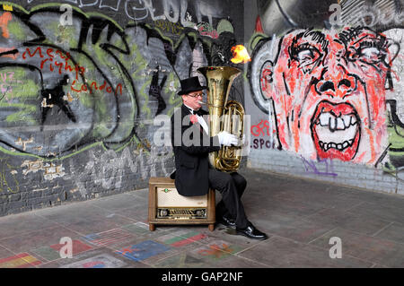busker musician playing tuba at borough market, london, england Stock Photo